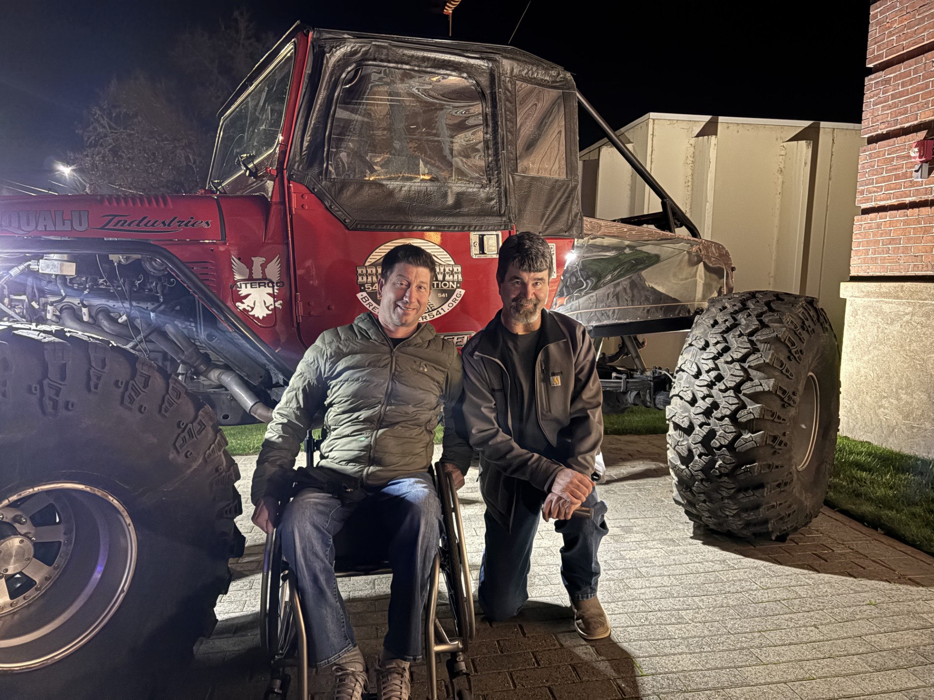 Brent and Julian together beside the foundation's off-road vehicle