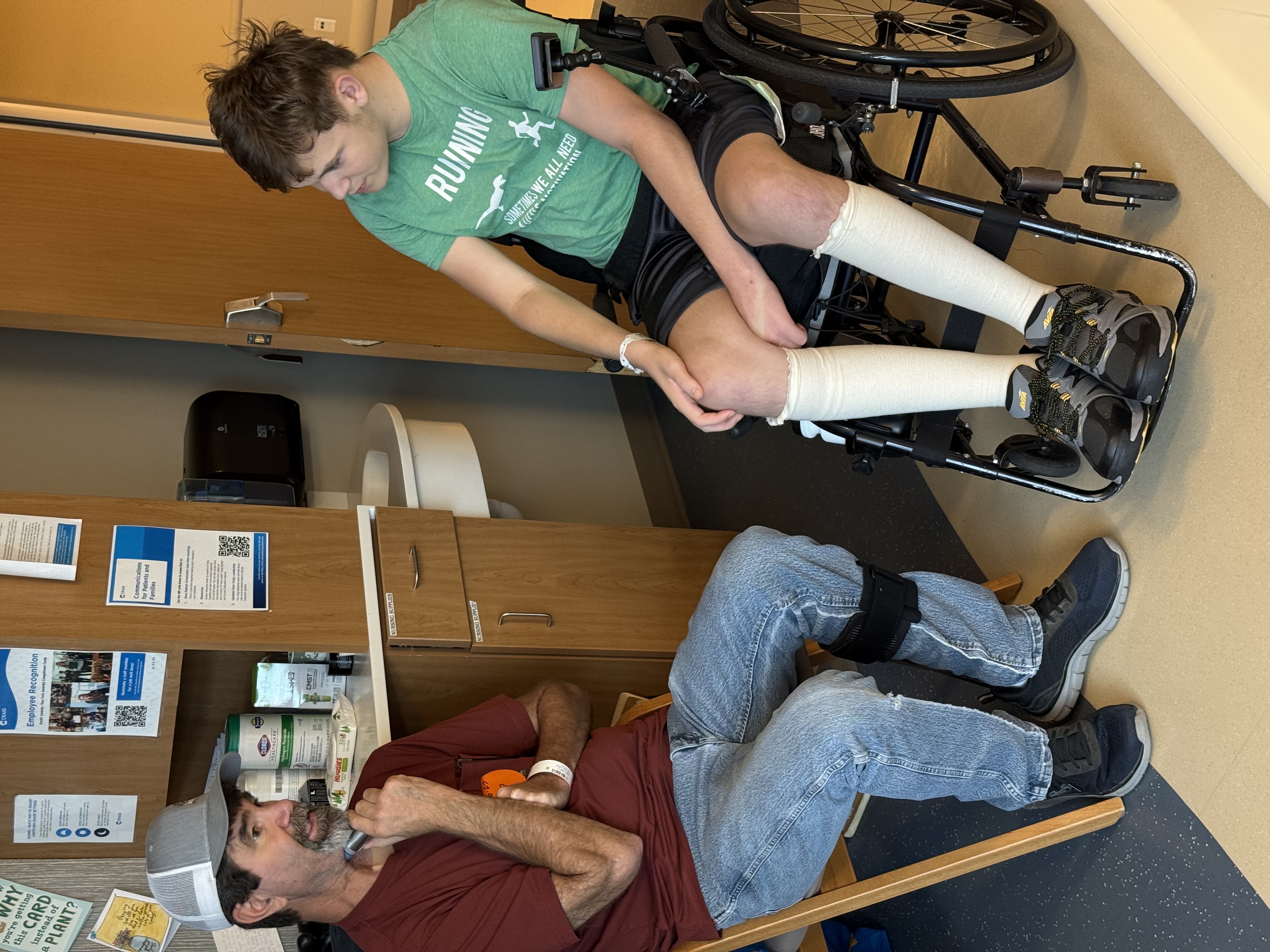Brent speaking with a young wheelchair user during recovery