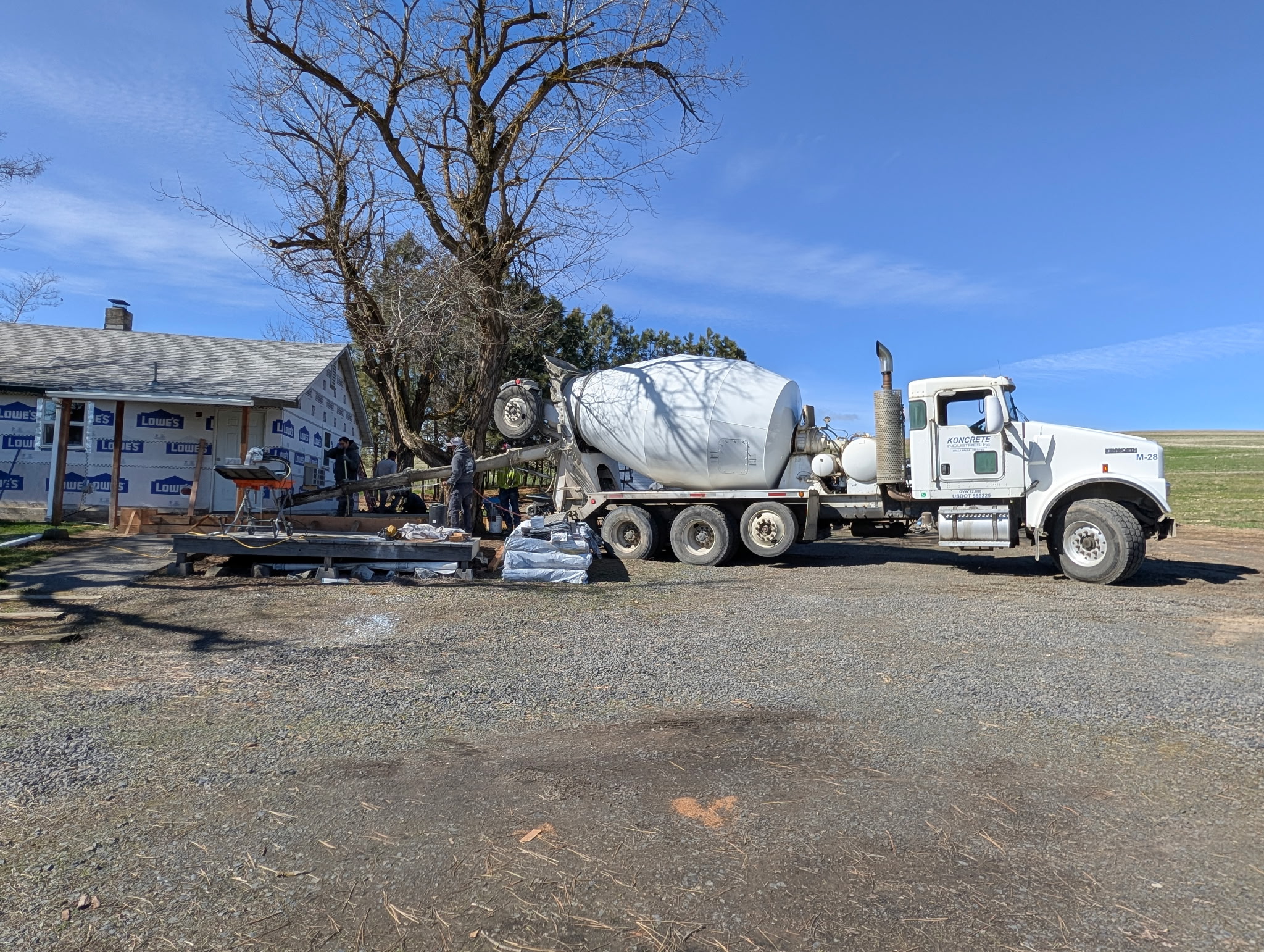 A concrete truck beside Tyler Hoffman’s home during accessibility construction